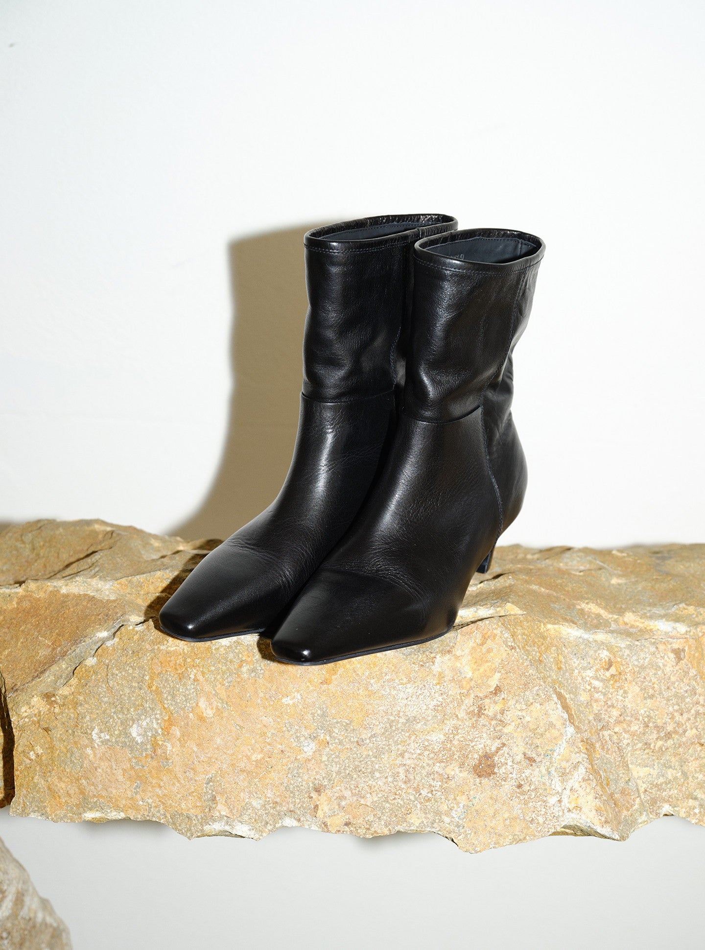 Sleek Black Leather Slouchy Stiletto Boots